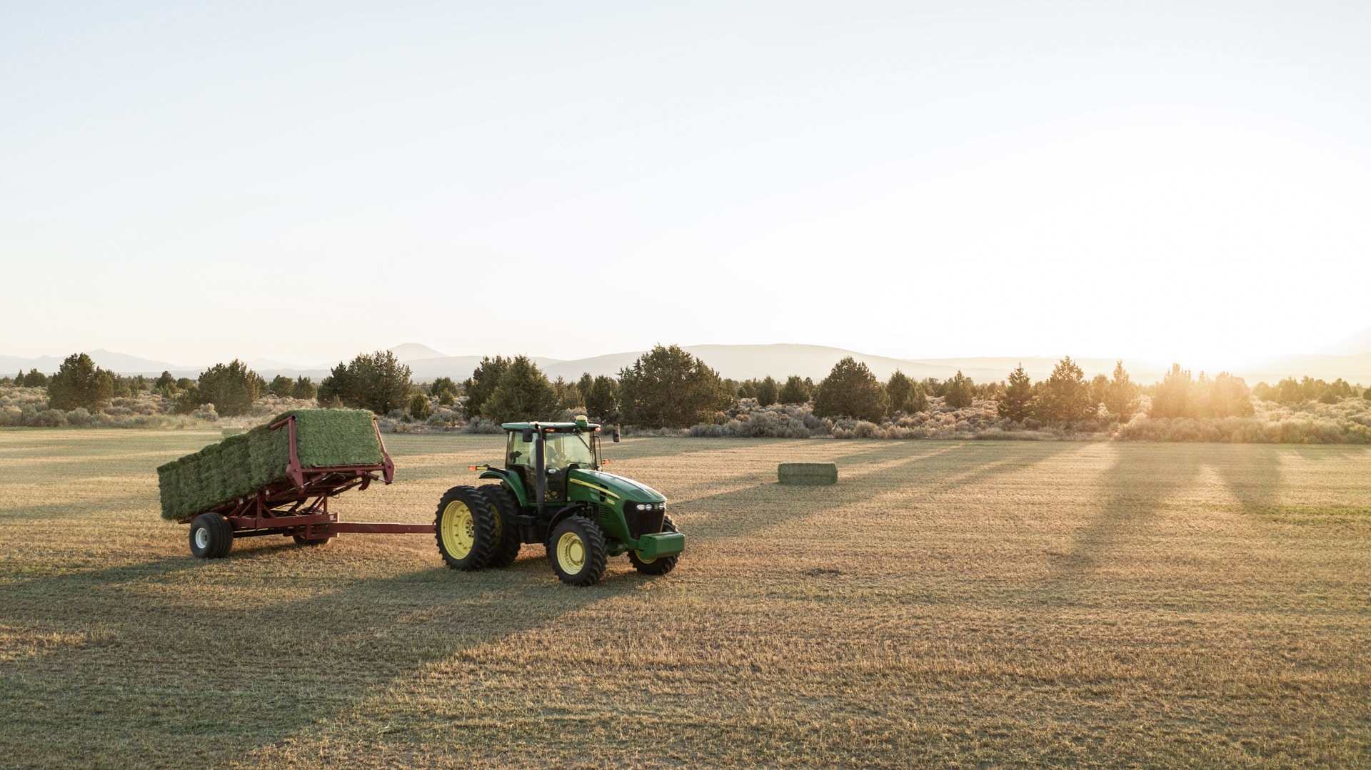 tractor with hay bale for organic straw and pet food learning center